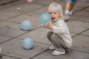 Boy playing with balloons