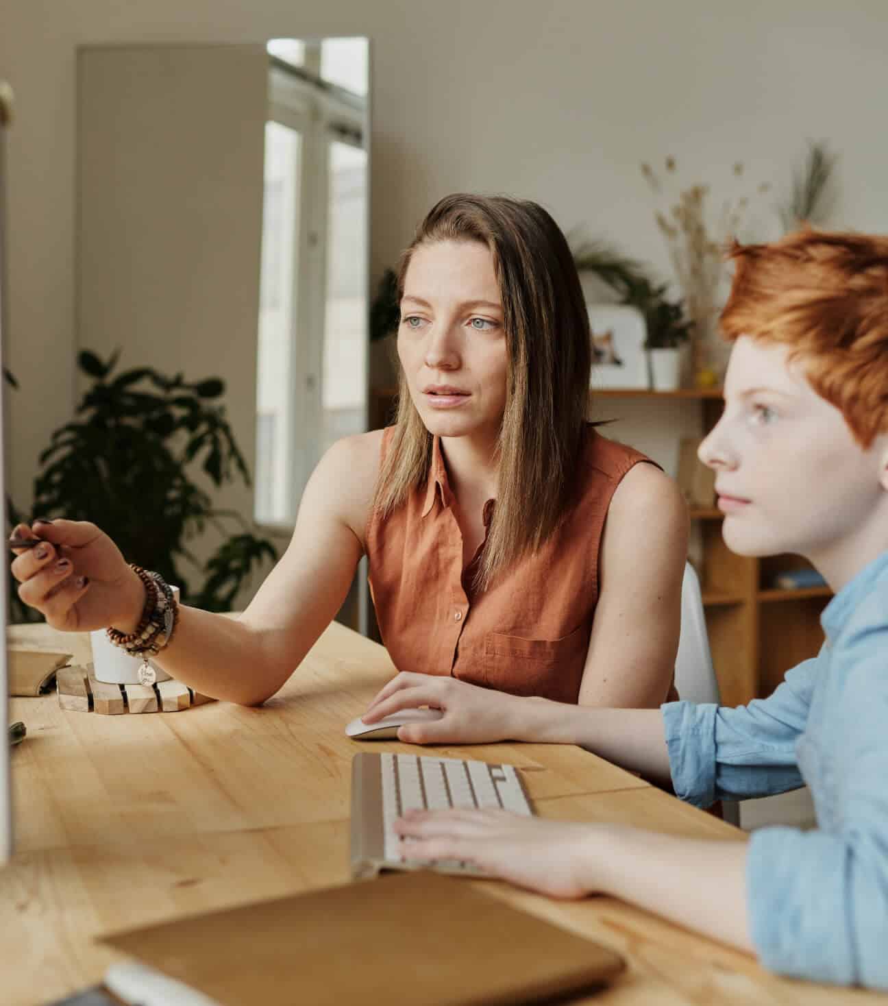 Woman and boy on computer